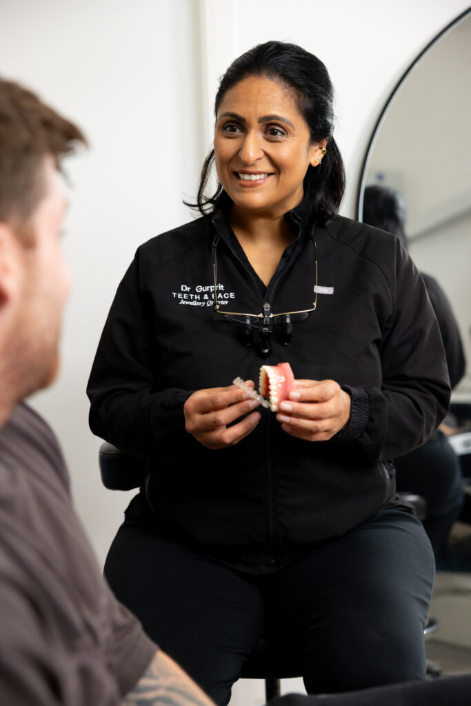 Dr Gurprit Demonstrating Invisalign with patient at Teeth & Face Birmingham