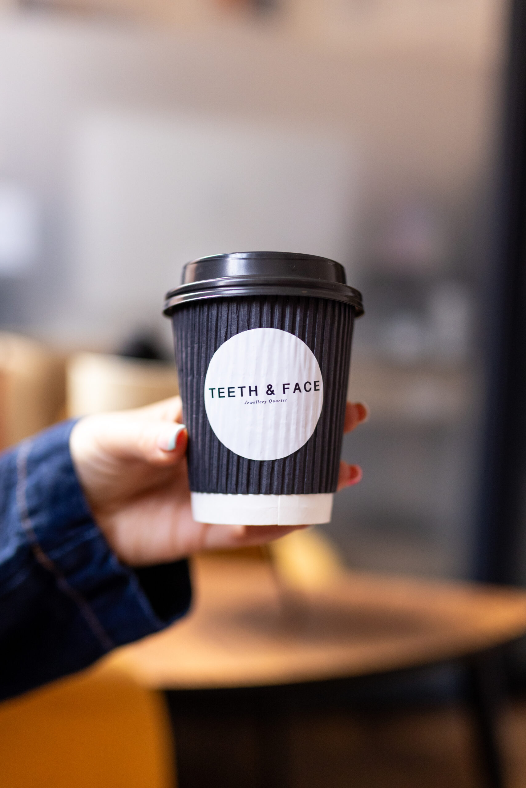 Teeth & Face Coffee Cup in Waiting Room