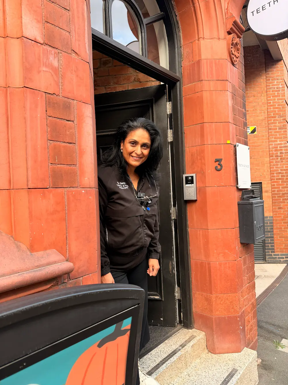 Dr Gurprit outside Teeth & Face Birmingham in the Jewellery Quarter